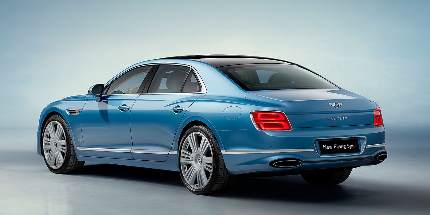 JCT600 Service Teeside New Bentley Flying Spur Azure sedan rear view in Light windsor blue by Mulliner paint with 22 inch Azure wheels and chrome exterior details