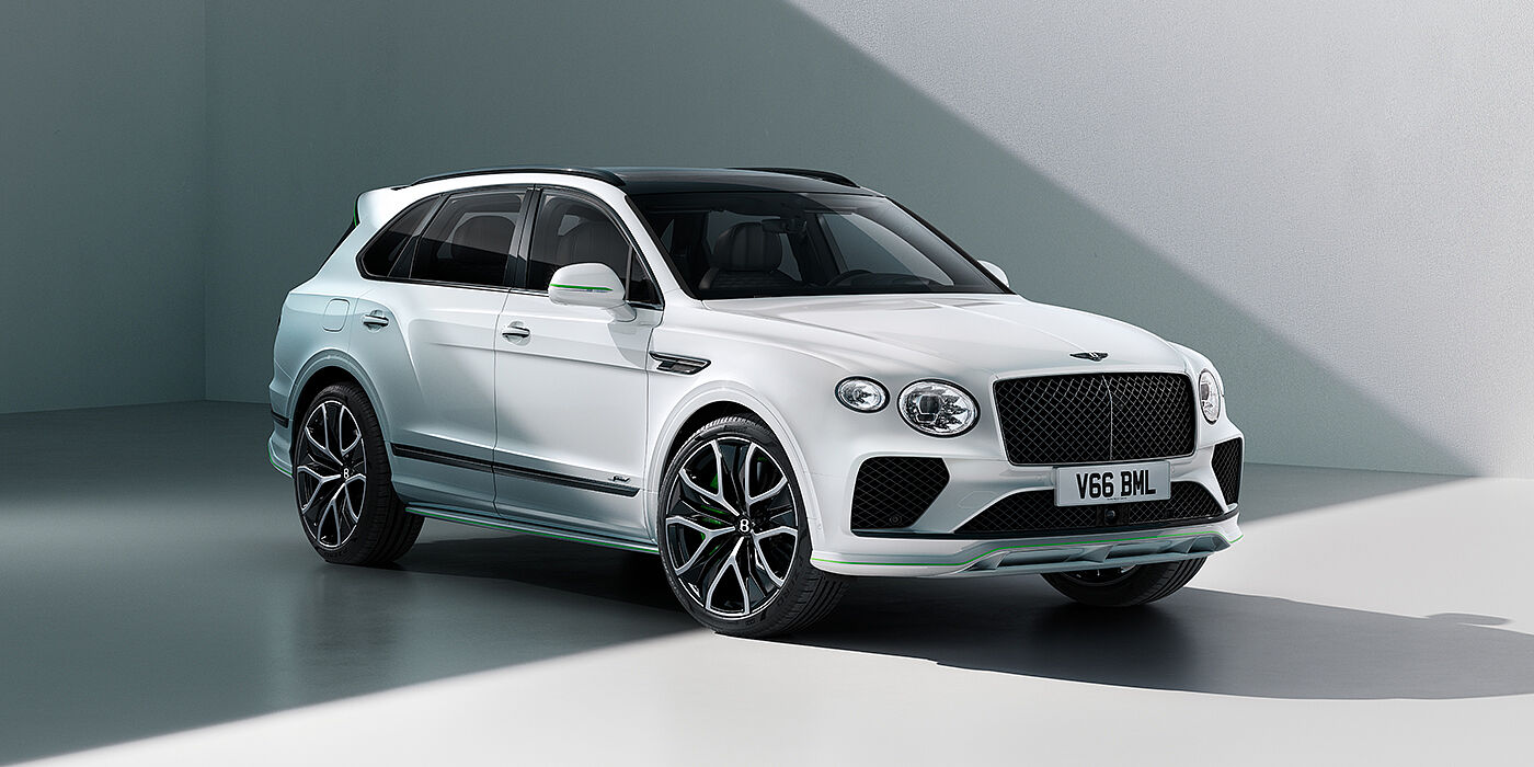 JCT600 Service Teeside Bentley Bentayga Speed SUV front three quarter in Snow Quartz Pearlescent by Mulliner white paint against a grey wall