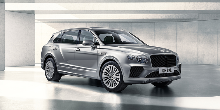 JCT600 Service Teeside Bentley Bentayga Extended Wheelbase SUV front three quarter in Moonbeam paint with a grey background