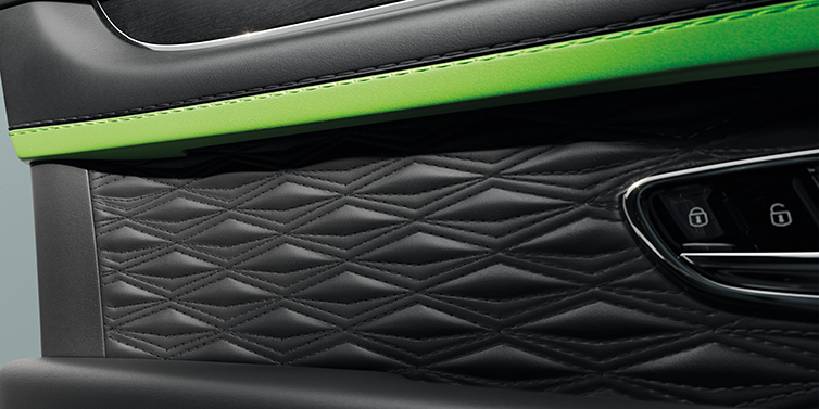 JCT600 Service Teeside Bentley Bentayga Speed SUV interior door detail with Diamond in Diamond stitched hide in Beluga black colour, with Black stained Crown Cut Walnut veneer