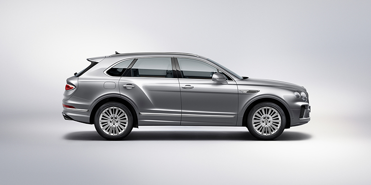 JCT600 Service Teeside Bentley Bentayga SUV side profile in Moonbeam silver paint against white background featuring 21 inch 5 spoke wheels