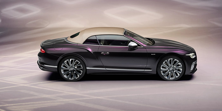JCT600 Service Teeside Bentley Continental GTC Mulliner convertible in profile with hood up, in Tanzanite Purple paint and 22 inch Mulliner painted and polished wheels