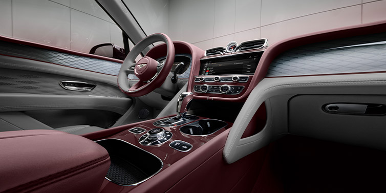JCT600 Service Teeside Bentley Bentayga Extended Wheelbase SUV front interior in Gravity Gray and Cricket Ball red hides with Dark Tint Diamond Brushed Aluminium veneer