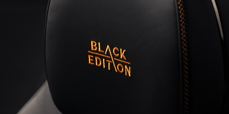 JCT600 Service Teeside Bentley Continental GT coupe seat headrest Black Edition stitched emblem in Mandarin colour against Beluga black hide