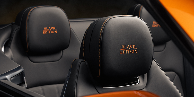 JCT600 Service Teeside Bentley Continental GTC Black Edition convertible seat detail with Beluga black hide and Mandarin emblem stitching