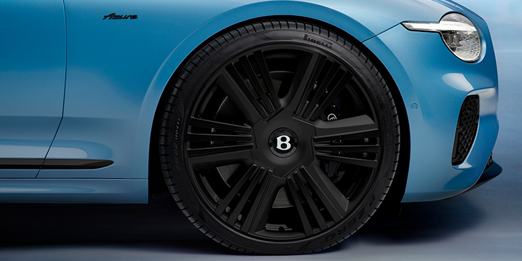 JCT600 Service Teeside New Bentley Continental GTC Azure convertible front wheel detail with 22 inch black ten spoke wheel and dark chrome details against Light Windsor blue paint