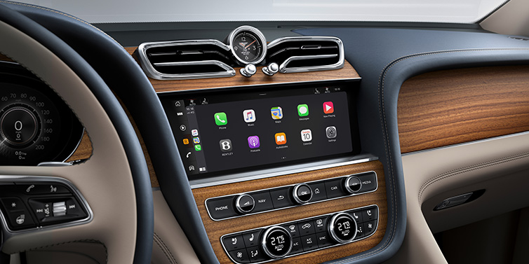 JCT600 Service Teeside Bentley Bentayga Extended Wheelbase Azure SUV front interior centre console with MMI screen showing apps, surrounded by Portland and Imperial Blue coloured hides