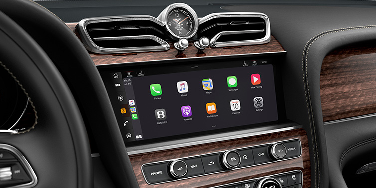 JCT600 Service Teeside Bentley Bentayga Extended Wheelbase SUV front interior centre console MMI screen showing apps surrounded by Beluga black hide and Crown Cut Walnut veneer