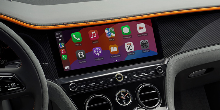 JCT600 Service Teeside Bentley Continental GT Speed coupe front interior centre console with MMI screen featuring Apps surrounded by Mandarin by Mulliner and Gravity Grey hides