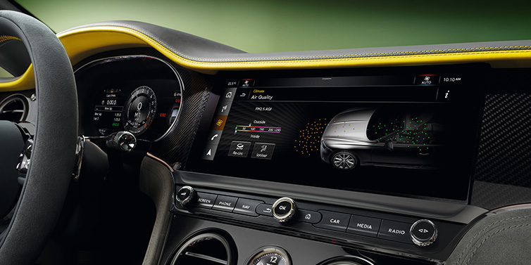 JCT600 Service Teeside Bentley Continental GTC Speed convertible front interior centre console with MMI screen showing Air Quality visualisation surrounded by Cyber Yellow by Mulliner and Gravity Grey hides and high gloss carbon fibre veneer