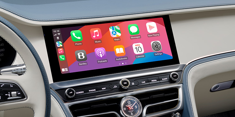 JCT600 Service Teeside New Bentley Flying Spur Azure sedan front cabin central MMI screen showing available services against Linen and Brunel hides and Piano Linen veneer