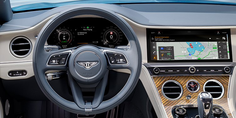 JCT600 Service Teeside New Bentley Continental GT Azure coupe front interior in Linen and Brunel blue hides, showing steering wheel and driver's instruments